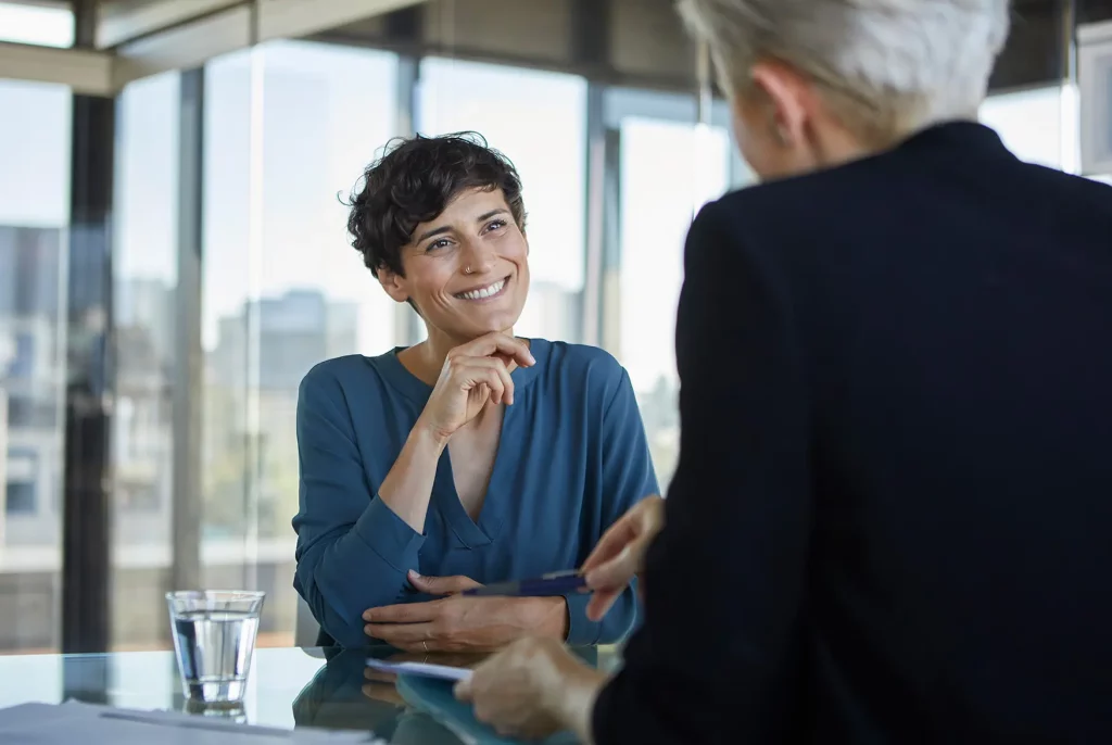 Homeowner consulting a local adviser about equity release options in Bristol with Preferred Equity Release branding.